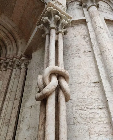 13th century — Four marble columns in Trento Cathedral, carved into intricate knots that feel almost impossible in stone. Location: Trento Cathedral, Italy