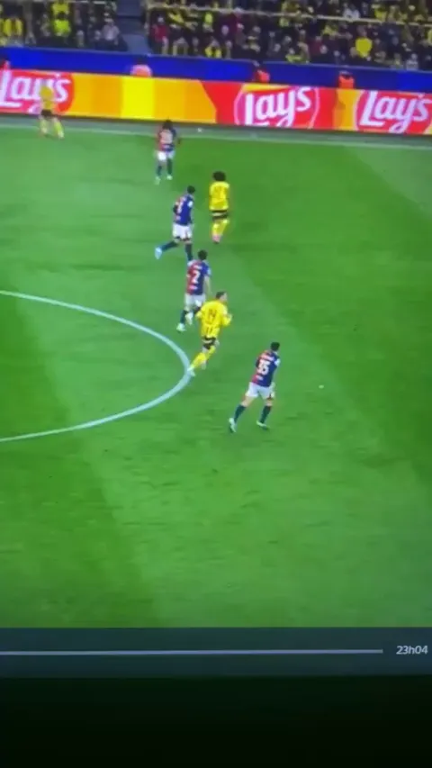 Gerrard Martin trying his best to keep the offside line against Dortmund