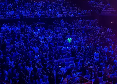 This one dude in the crowd in a neon shirt.