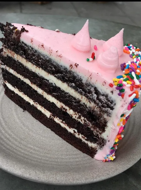 Multi layer chocolate cake with strawberry frosting. We are celebrating tonight!