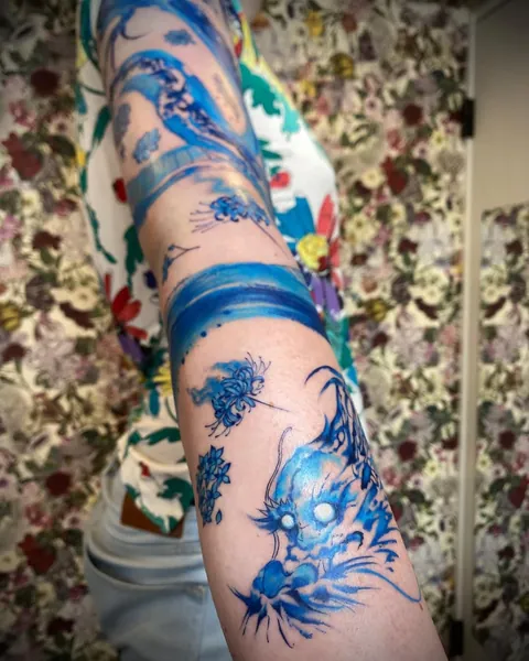 Blue abstract dragon &amp; flowers- my first tattoo by Haruka (Tokyo)