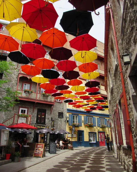 I loved when I went to Quebec City last year and they had umbrellas hanging about the street! Such a cool feature.