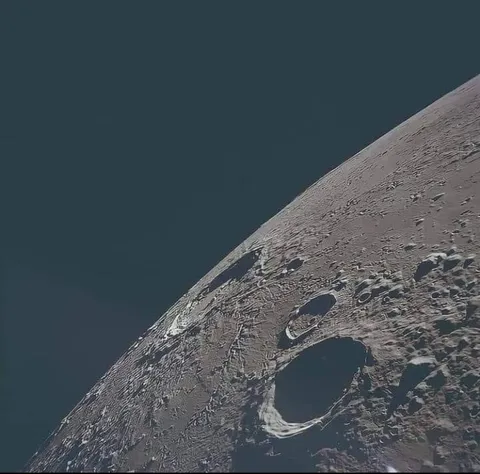 Moon, Captured by an Apollo 12 astronaut Most likely, this photo was taken by Richard F. Gordon, the pilot of the command module.