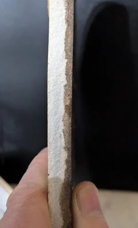 The amount of pizza grease that soaks into a pizza stone over the course of 21 years of use.