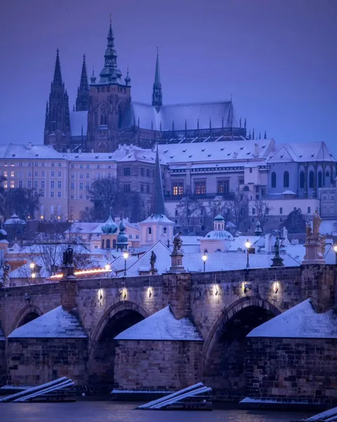 St. Vitus Cathedral within the Prague Castle seen beyond the Charles Bridge across the Vltava River, Prague, Czech Republic.