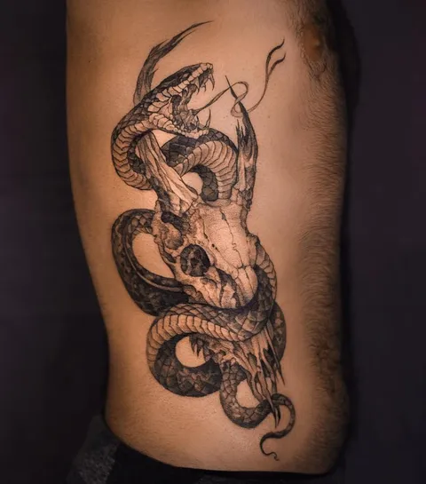 Snake and skull, done by Ahmad Jomaa at Morbid Tattoo in Beirut, Lebanon.