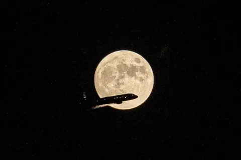 ITAP of a plane flying in front of the moon