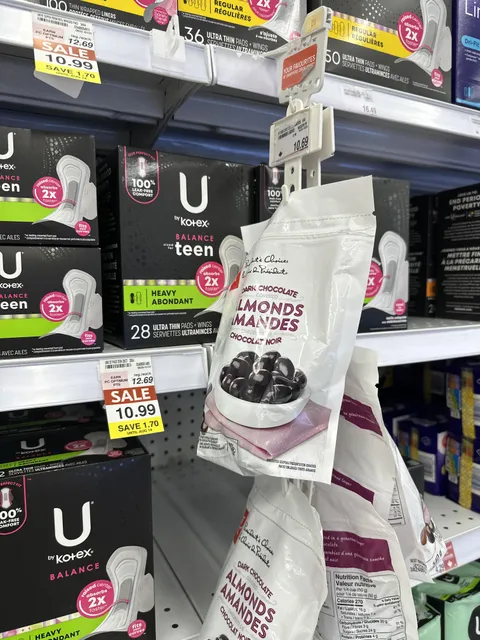 This grocery store keeps the chocolate covered almonds in front of the pads