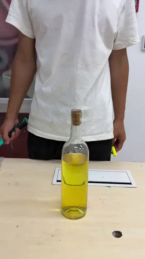 Retrieving a cork that has fallen into a wine bottle