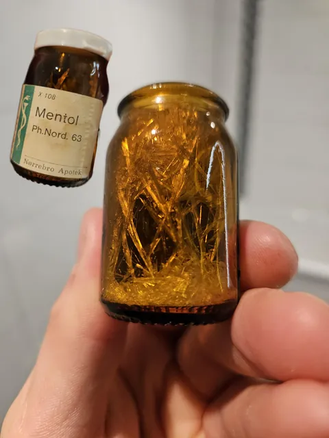 Old bottle of menthol that crystallized