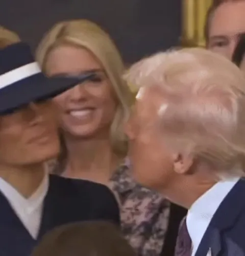 Donald "kisses" Melania before the Oath of Office