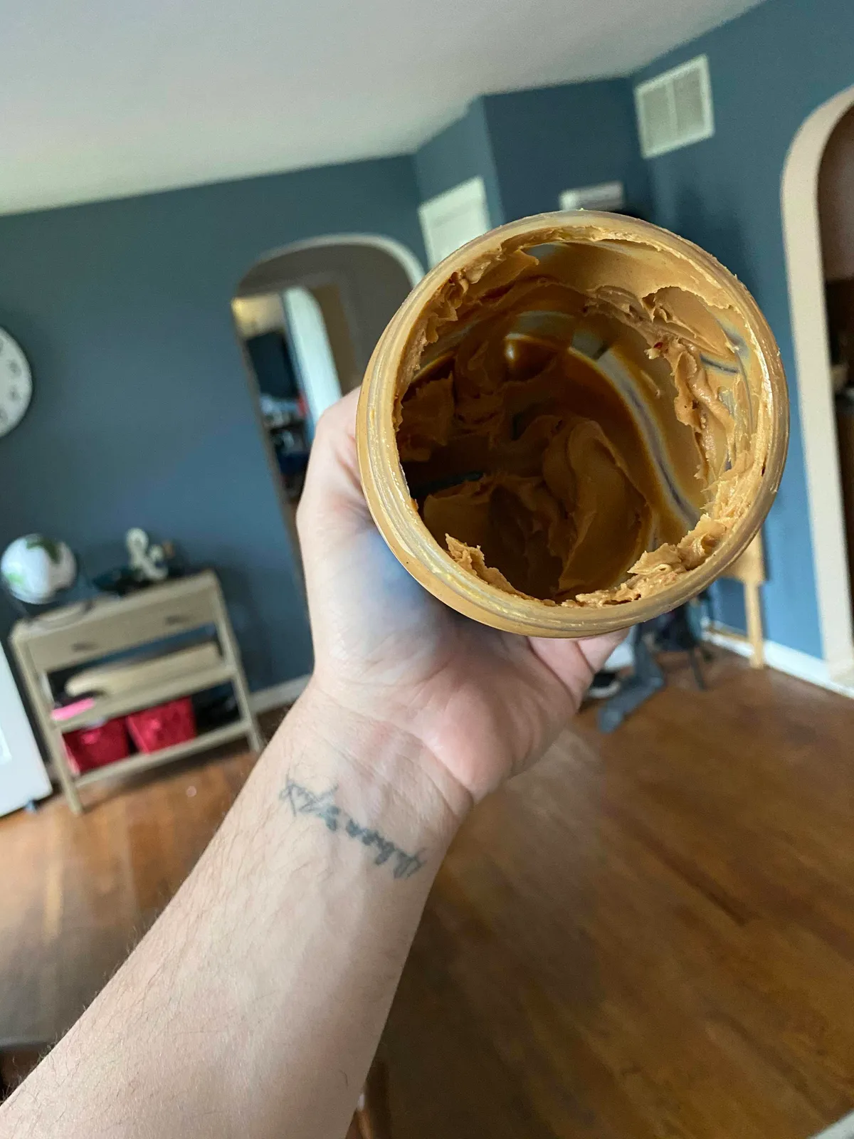 My wife putting this peanut butter in the trash because it’s empty...
