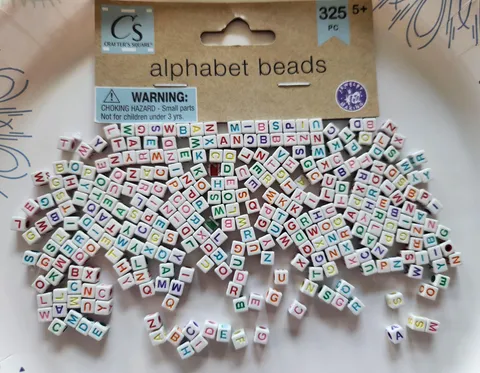These alphabet beads I bought for my son. 325 pieces and not one J. His name starts with a J.