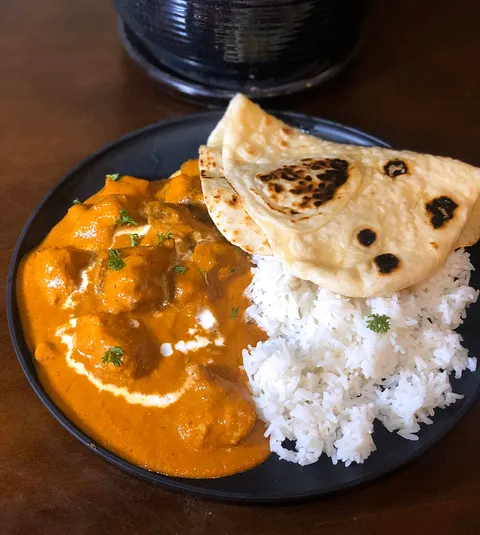Homemade butter chicken with homemade naan!