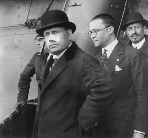 First pic of Mussolini after an assassination attempt during a rally. The bullet grazed his nose    