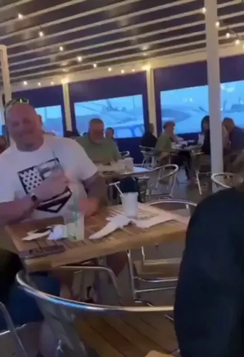 A bunch of random people making a baby's day better