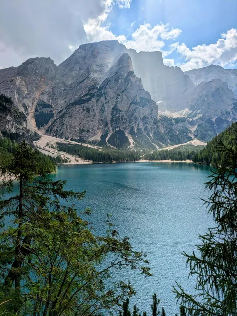 [OC] (3472 x 4624) Sun peaking out at Lake Braies, Dolomites, Italy