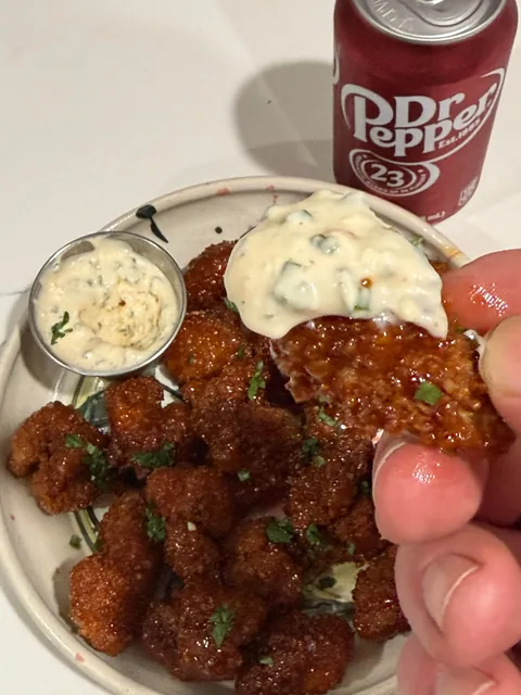 [homemade] boneless wings or saucy nugs or popcorn chicken or something.