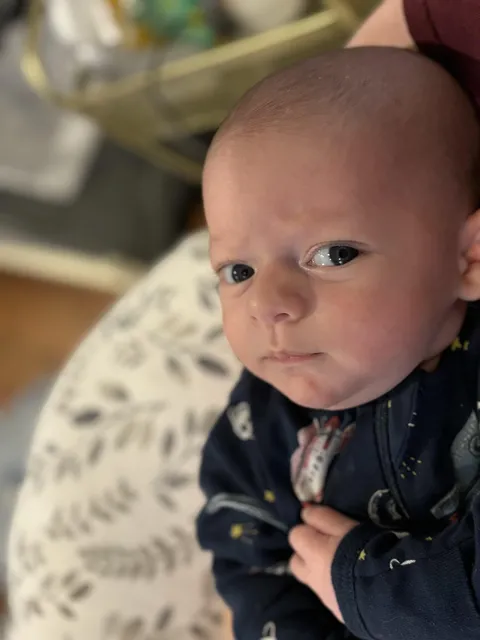 My newborn is a judgy asshole. This is how he looks at me everyday.