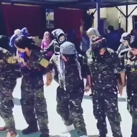 Kurdish female soldiers dancing in Raqqa after defeating ISIS, on streets where ISIS bought and sold women.