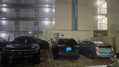 Three ICE Cars Taking Up The Three Electric Charging Spots At The Hotel