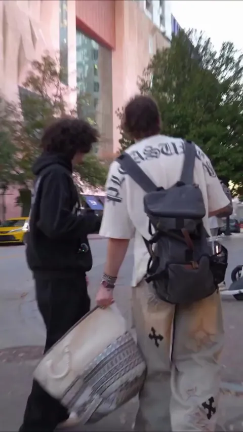 Asking random strangers to take a picture of them