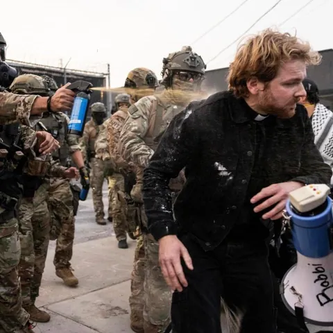 A priest was assaulted by masked ICE agents during Friday’s protests.