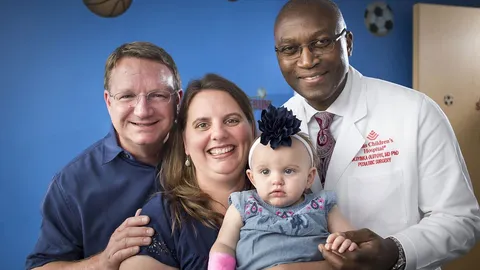 Nigerian Surgeon, Dr. Oluyinka Olutoye and Dr. Darrell Čass cut a woman baby out her womb at 23 weeks old, successfully operated on the baby after taking out a tumor, then placed the baby back into the mom’s womb and the baby was later delivered healthy and naturally on time at 36 weeks.