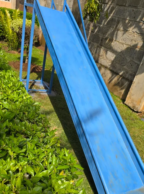 Made my kids a metal slide. How do I make it smooth. They have to push themselves.