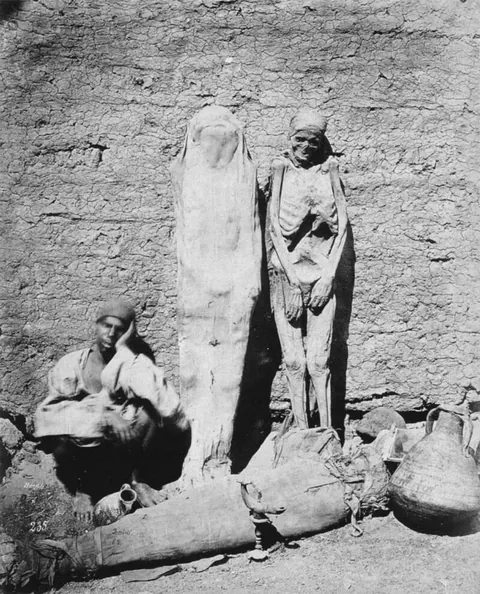 Street vendor selling mummies in Egypt, (1865)