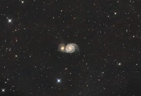 I pointed my telescope at the Whirlpool Galaxy for 6 hours and got this picture of it