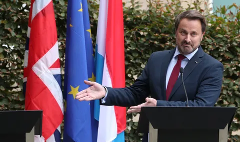 PsBattle: The PM of Luxembourg pointing out Boris Johnson's absence.