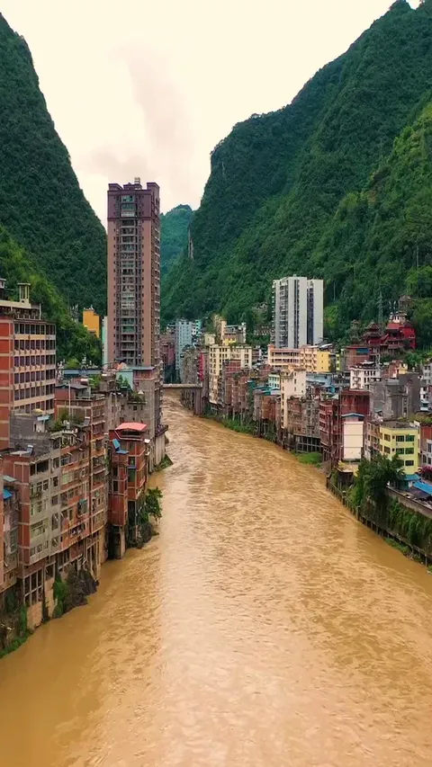 Yanjin, the narrowest city in the world. At its widest, the city spans no more than 300 meters (1,000 feet), with some sections narrowing to just 30 meters (100 feet). The population is about 500,000.