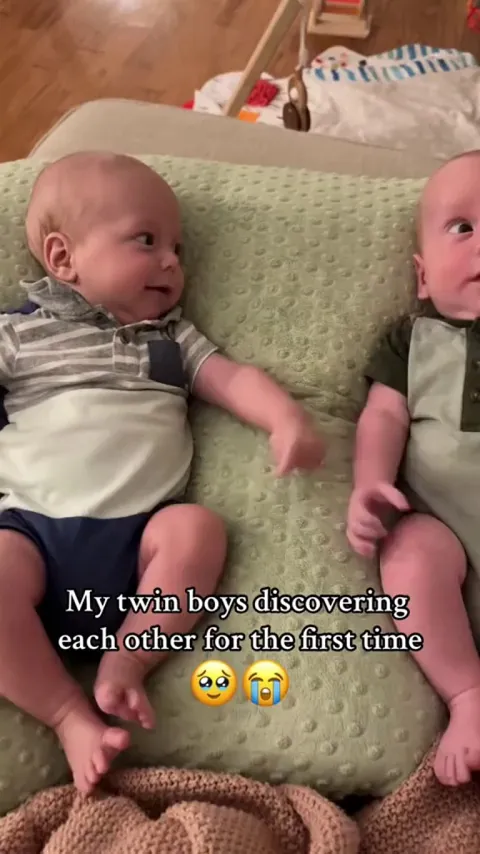 Twins discovering each other for the first time