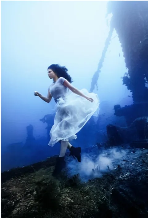 Canadian photographer Steven Haining breaks world record for deepest underwater photoshoot at 163ft - model poses on shipwreck WITHOUT diving gear