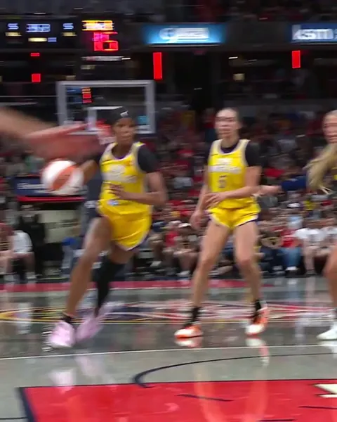 Makayla Timpson with the block against Rickea Jackson