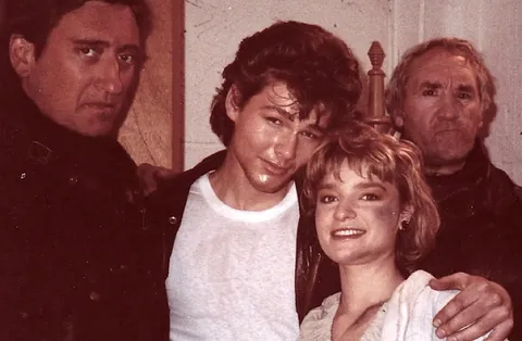 Morten Harket, A-ha's frontman, and actress Bunty Bailey share the scene with two villainous bikers on the set of the "Take On Me" music video. 1985