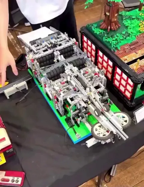 A LEGO creator in Japan built a fully automated paper-airplane machine from scratch.