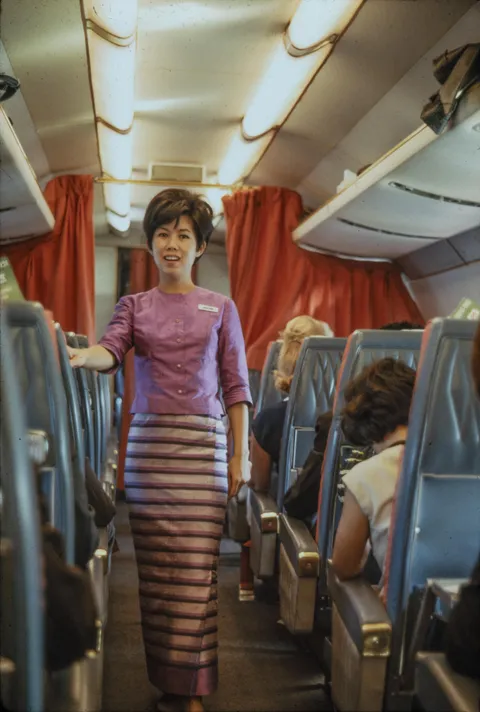 An Asian flight attendant on the plane, 1966, shot with Kodachrome
