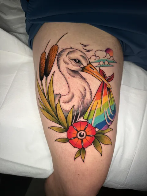 Stork carrying rainbow baby. By Joshua Kizer, at Bad Wave Tattoo, Roanoke, Va