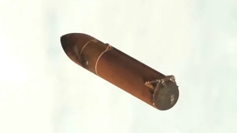 A 47-meter giant external tank drifting in space