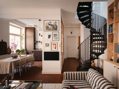 Living space with a spiral staircase in a duplex of a 1910 building, Södermalm, Stockholm City Centre, Sweden [2133x1600]