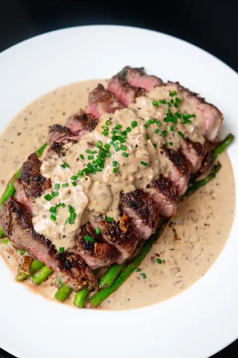 [homemade] steak and asparagus with a mushroom cream sauce.