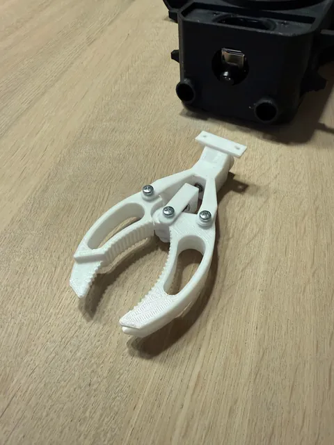 My wife dropped her sunglasses into a deep lake, so I built a small underwater ROV with a gripper to try to retrieve them