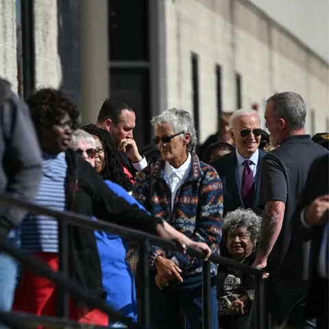 President Biden standing in line to vote
