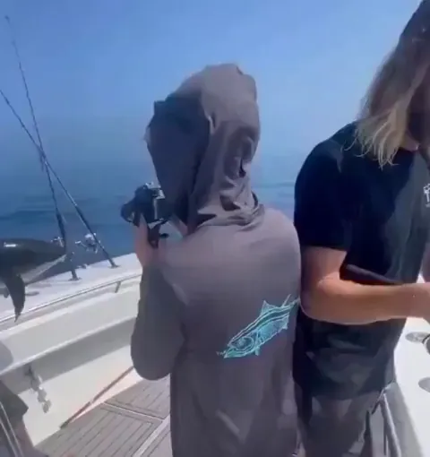 Returning a fish to its home.