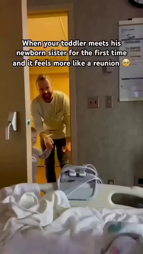 This precious toddler completely steals the show when he meets his baby sister for the very first time.