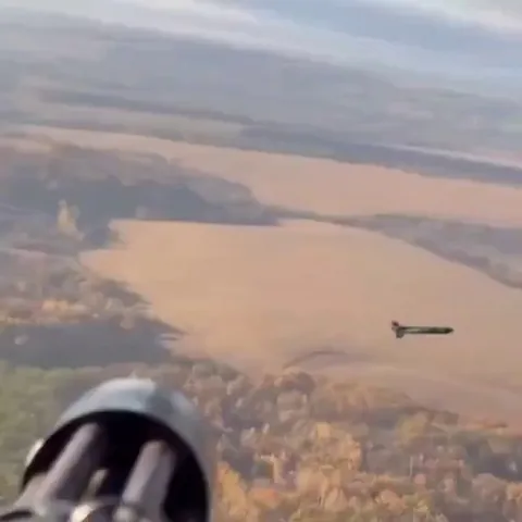 A helicopter gunner shot down a drone with barrage of bullets