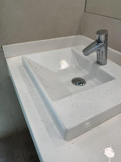 Someone shaved on the airport restroom