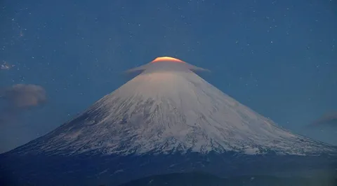 🔥 A cloud over Klyuchevskaya Sopka volcano is illuminated by lava